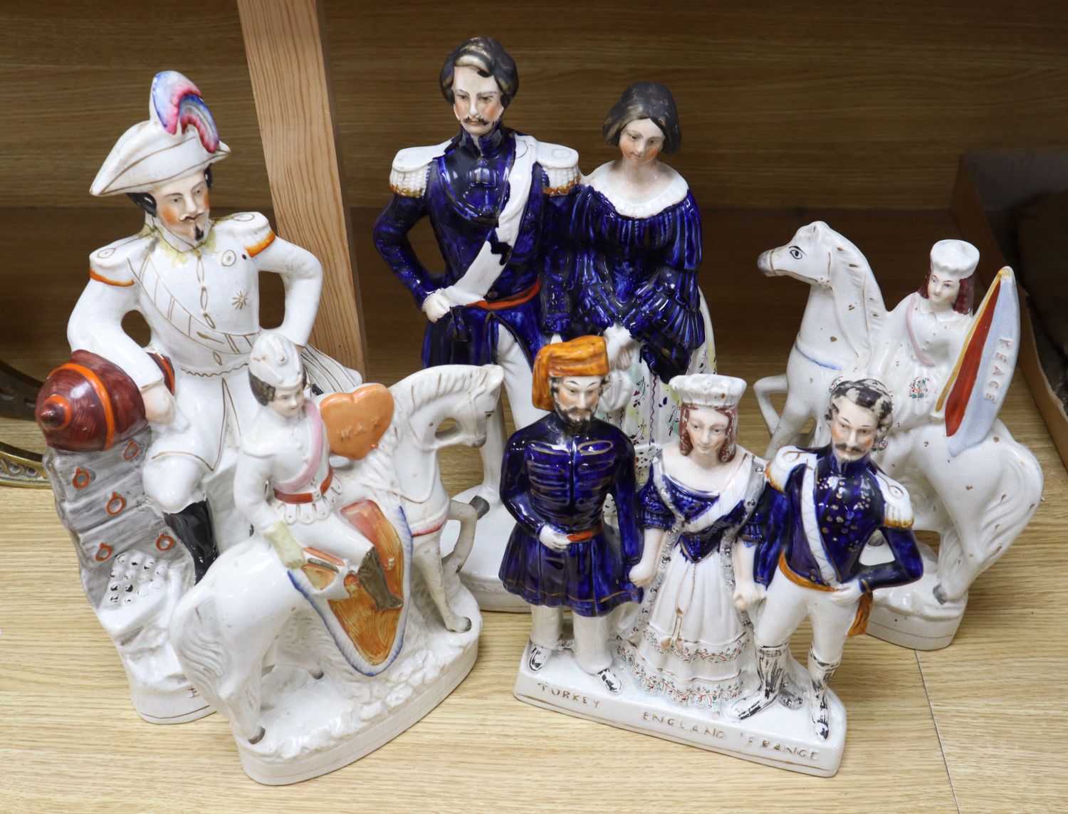 Five mid 19th century Crimean War related Staffordshire figure groups including EN. Napoleon, 40cm (some damage)